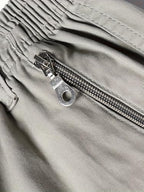 Pantalones cortos casuales para hombre, hechos de 100 %, con bolsillos con cremallera y una cintura ajustable con cordón